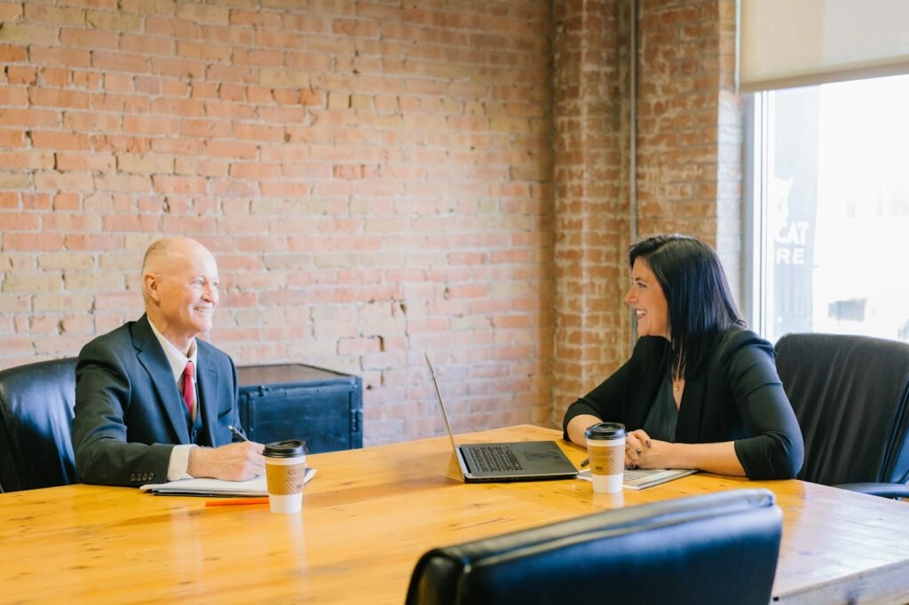 Bookkeeper meeting with a small business owner to review a plan